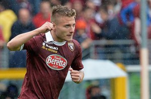 Torino's forward Ciro Immobile celebrates with his teammates after scoring during the Italian Serie A soccer match between Torino FC and Udinese Calcio at Olimpico Stadium in Turin, 27 April 2014. ANSA/ ALESSANDRO DI MARCO